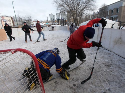 PHIL HOSSACK / Winnipeg Free Press - Street Hockey teams "Dirty Tom and the Dogs" and "The Road Warriors" kept the action going Saturday in the annual Osborne Village Business Improvement Zone's annual street hockey tournament. Alex Paul's story.  -  January 27, 2018