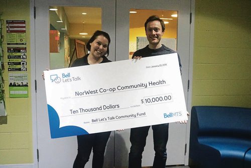 Canstar Community News Jan. 24, 2018 - Kaelee Vandenbogerd, youth counsellor with the Youth Hub and Mark Aitken, community programmer with the Youth Hub, hold the 2017 Bell Lets Talk Fund donation cheque. (LIGIA BRAIDOTTI/CANSTAR COMMUNITY NEWS/TIMES)