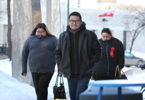 RUTH BONNEVILLE / WINNIPEG FREE PRESS

People attending the 1st day of trial for the man accused of murdering Tina Fontaine make their way into the Law Courts Building some wearing a red bow on their left side Monday.  Names I know - Bryan Favel - Tina's uncle and Shawna Smith (on left in grey).  


Jan 29, 2018
