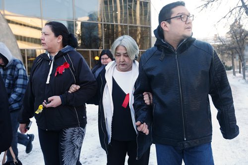 JOHN WOODS / WINNIPEG FREE PRESS
Thelma Favel (C) and Brian Favel (R), Tina Fontaine's aunt and uncle, leave the law courts with unidentified family members after the first day of testimony in the 2nd degree murder trial of Raymond Cormier, Fontaine's alleged killer, in Winnipeg Monday, January 29, 2018.