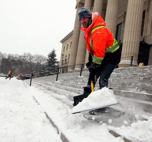 BORIS MINKEVICH / WINNIPEG FREE PRESS
Provincial govt gardener/grounds keeper Bryan Haswell shovels the snow off the steps of the Manitoba Legislature this morning. STANDUP PHOTO January 30, 2018