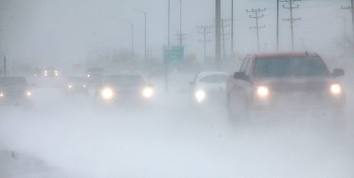 PHIL HOSSACK / WINNIPEG FREE PRESS - Traffic moves slowly at Main Street and the North Perimeter Tuesday afternoon as increasing winds and blowing snow hampered visibility. At least three school divisions were forced to cancel bus rides home for students due to the weather.  - January30, 2017