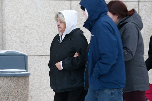JOHN WOODS / WINNIPEG FREE PRESS
Thelma Favel (L), Tina Fontaine's aunt, leaves the law courts with unidentified family members after the second day of testimony in the 2nd degree murder trial of Raymond Cormier, Fontaine's alleged killer, in Winnipeg Tuesday, January 30, 2018.