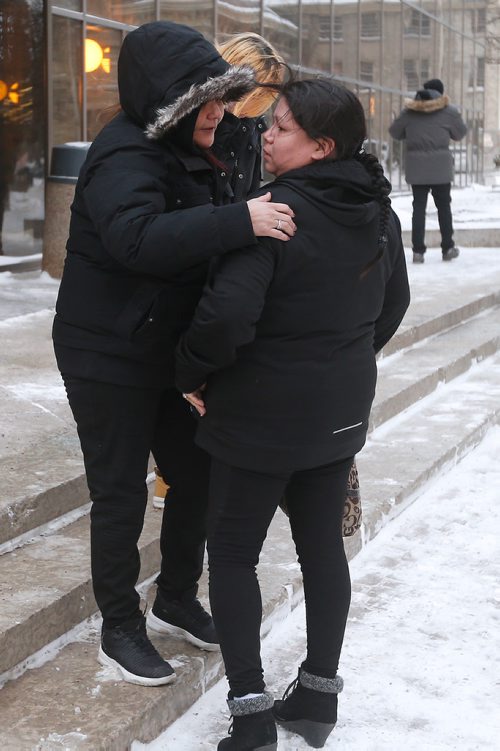 JOHN WOODS / WINNIPEG FREE PRESS
Tina Duck (R),  Tina Fontaine's mother, is comforted by friends as she leaves the law courts after the second day of testimony in the 2nd degree murder trial of Raymond Cormier, Fontaine's alleged killer, in Winnipeg Tuesday, January 30, 2018.