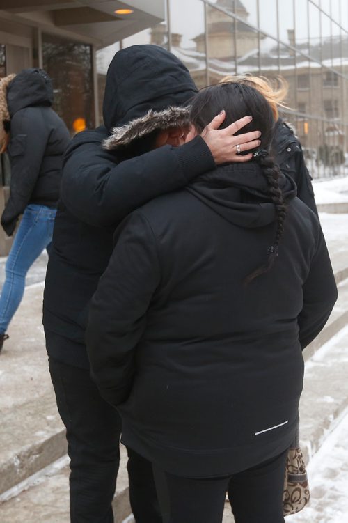 JOHN WOODS / WINNIPEG FREE PRESS
Tina Duck (R),  Tina Fontaine's mother, is comforted by friends as she leaves the law courts after the second day of testimony in the 2nd degree murder trial of Raymond Cormier, Fontaine's alleged killer, in Winnipeg Tuesday, January 30, 2018.
