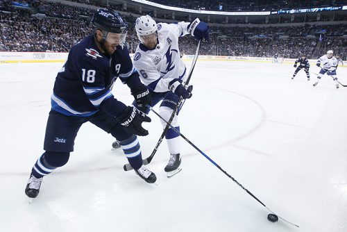 JOHN WOODS / WINNIPEG FREE PRESS
Winnipeg Jets' Bryan Little (18) and Tampa Bay Lightning's Anton Stralman (6) fight for the puck during second period NHL action in Winnipeg on Tuesday, January 30, 2018.
