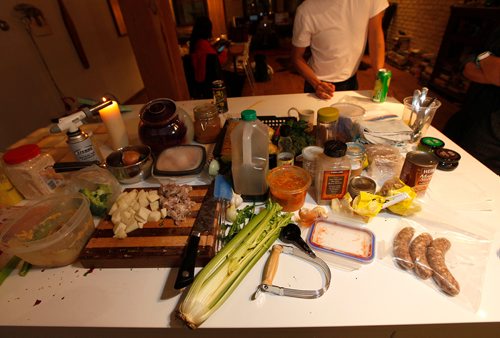 PHIL HOSSACK / WINNIPEG FREE PRESS - Leftovers grace the kitchen counter as Chef/Artist Pepe Dayah chats prior to whipping up a meal of leftovers Tuesday. See Jill Wilson's story.- January30, 2017