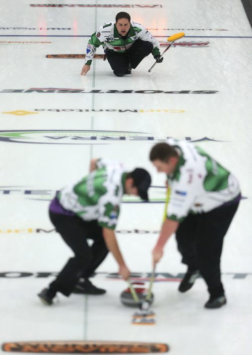 TREVOR HAGAN / WINNIPEG FREE PRESS
Skip Kelly Marnoch from the Carberry Curling Club throws a rock while Branden Jorgensen and Chris Cameron sweep, at the 2018 Viterra Championship in Winkler, Wednesday, January 31, 2018.