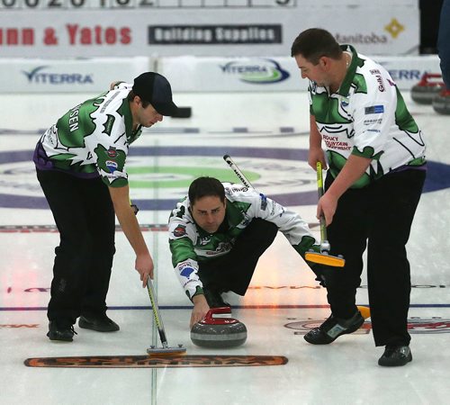TREVOR HAGAN / WINNIPEG FREE PRESS
Skip Kelly Marnoch from the Carberry Curling Club throws a rock while Branden Jorgensen and Chris Cameron sweep, at the 2018 Viterra Championship in Winkler, Wednesday, January 31, 2018.