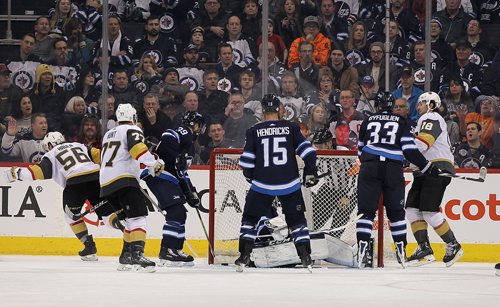 RUTH BONNEVILLE / WINNIPEG FREE PRESS

Vegas Golden Knights score against the  Winnipeg Jets during the 2nd period making the score 2-1 for Vegas  at BellMTS Centre Thursday evening.  The goal was controversial because it looked like the Jets goalie #37 Connor Hellebuyck, was obstructed or struck by Vegas #18 James Neal.  

Feb 01, 2018
 
