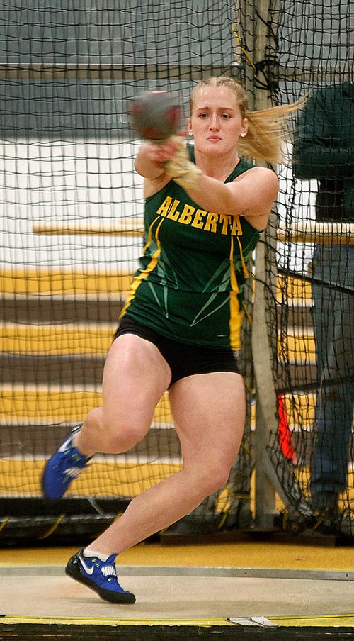PHIL HOSSACK / Winnipeg Free Press -  Emily Cliff of the Univercity of Alberta Track and Field team winds up in the "Weight Toss" friday evening as the Bison Classic Track and Field event kicked off. See release. -  February 2, 2018