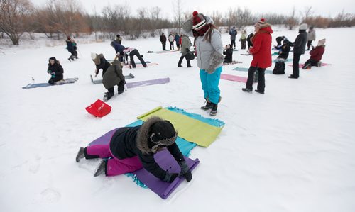 PHIL HOSSACK / Winnipeg Free Press - Dressed for a -22C session, Lindsay Waters spreads her yoga mat on top of a blanket shared with her sister  air at Fort Whyte Alive's Fire and Ice Festival. They and about thirty other participants were taking in a session of "ice Yoga on "Lake 3" at the outdoor centre. See Solomon Isreal's story.-  February 3, 2018