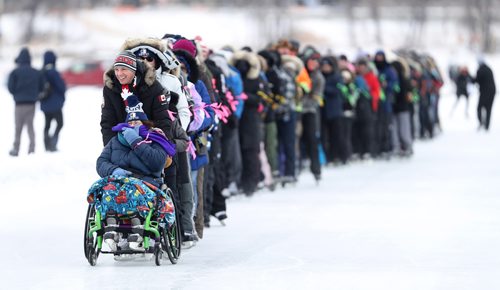 TREVOR HAGAN / WINNIPEG FREE PRESS
Natalie Pirson and Mayor Brian Bowman lead the way. Skaters turned up at The Forks for a Guinness World Record attempt for the longest line of ice skaters, Sunday, February 4, 2018.