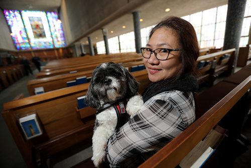 TREVOR HAGAN / WINNIPEG FREE PRESS
Victoria Drapete, and her service dog, Poncho, at St. George's Anglican Church, for faith page, Sunday, February 4, 2018.