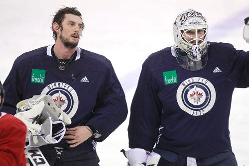 BORIS MINKEVICH / WINNIPEG FREE PRESS
Winnipeg Jets practice at MTS Bell Place. From left, goalie #37 Connor Hellebuyck and goalie #34 Michael Hutchinson. MIKE MCINTYRE STORY Feb. 5, 2018