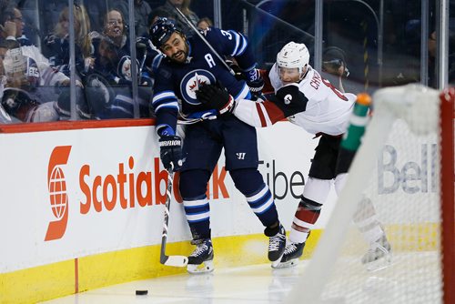 JOHN WOODS / WINNIPEG FREE PRESS
Winnipeg Jets' Dustin Byfuglien (33) and Arizona Coyotes' Jakob Chychrun (6) battle for the puck during second period NHL action in Winnipeg on Tuesday, February 6, 2018.