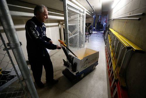 JOHN WOODS / WINNIPEG FREE PRESS
Kevin Cameron, member of the Ice Crew, gets the "mini-zamboni" organized for the skaters before first period NHL action between the Winnipeg Jets vs Arizona Coyotes in Winnipeg on Tuesday, February 6, 2018.