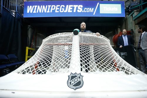 JOHN WOODS / WINNIPEG FREE PRESS
Paul Lazarenko, member of the Ice Crew, waits to move the game goal onto the ice prior to first period NHL action between the Winnipeg Jets vs Arizona Coyotes in Winnipeg on Tuesday, February 6, 2018.