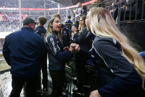 JOHN WOODS / WINNIPEG FREE PRESS
Emily Carey and Jen Derksen, members of the Ice Crew, celebrate an early Jets goal during first period NHL action between the Winnipeg Jets vs Arizona Coyotes in Winnipeg on Tuesday, February 6, 2018.