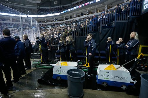 JOHN WOODS / WINNIPEG FREE PRESS
Members of the Ice Crew wait for the next ice cleaning during first period NHL action between the Winnipeg Jets vs Arizona Coyotes in Winnipeg on Tuesday, February 6, 2018.