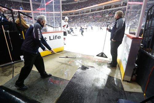 JOHN WOODS / WINNIPEG FREE PRESS
Kevin Cameron (L) and Paul Lazarenko, members of the Ice Crew, keep the entrance clear during first period NHL action between the Winnipeg Jets vs Arizona Coyotes in Winnipeg on Tuesday, February 6, 2018.