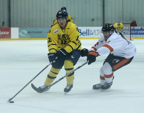 RUTH BONNEVILLE / WINNIPEG FREE PRESS

Winnipeg Blues #12  works the puck down the ice as  Winkler Flyers #12 MITCHELL DYCK  tries to get the puck from him during action at Iceplex Tuesday evening. 

Sports standup
February 7, 2018.
 
