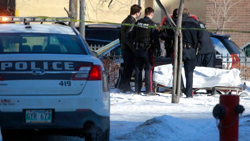 BORIS MINKEVICH / WINNIPEG FREE PRESS
Winnipeg Police Service WPS on scene in the park across the street from the Burton Cummings Theatre where a body was found. Feb. 8, 2018