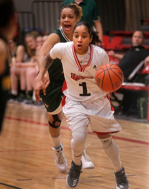 PHIL HOSSACK / Winnipeg Free Press -  U of W Wesmen's #1 Anoinette Miller leaves UNBC Timberwolf # 12 Maria Mongomo in her wake Thursday evening as the teams met at the Duckworth Centre in Canada West Basketball Playoff action. -  February 8, 2018