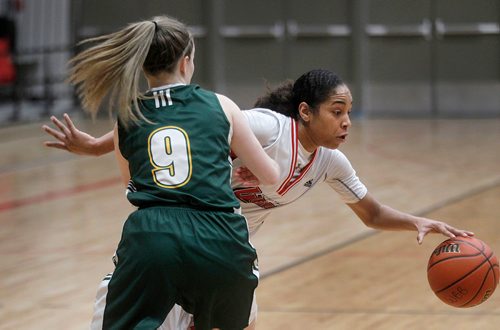 PHIL HOSSACK / Winnipeg Free Press -  U of W Wesmen's #1 Anoinette Miller takes the long road around UNBC Timberwolf #9 Emily Holmes Thursday evening as the teams met at the Duckworth Centre in Canada West Basketball Playoff action. -  February 8, 2018