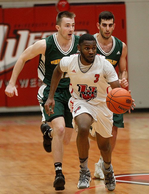 PHIL HOSSACK / Winnipeg Free Press -  U of W Wesmen's # 3 Narcisse Anbanza works up court with UNBC Timberwolfs #12 Adam Pahl (left) and #11 Vaggelis Loukas in pursuit Thursday evening as the teams met at the Duckworth Centre in Canada West Bask5 etball Playoff action. -  February 8, 2018