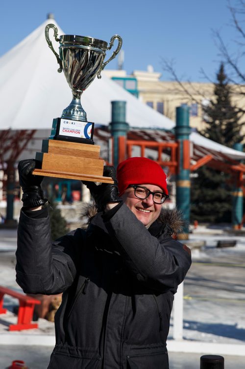 MIKE DEAL / WINNIPEG FREE PRESS
Steinbach Mayor Chris Goertzen hoists the Mayor's Cup after winning the first ever Mayor's Cup Crokicurl Tournaspiel at The Forks Friday afternoon. He played against the mayor's of Winkler, Martin Harder, and Winnipeg, Brian Bowman. Chris Goertzen won the Mayor's Cup after beating Mayor Bowman in a tiebreaker.
180209 - Friday, February 09, 2018.