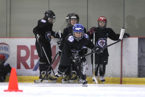 RUTH BONNEVILLE / WINNIPEG FREE 

49.8 TNYF feature.  Grade 4/5 students from Crestview School learn to play hockey on ice with Murray Cobb, Director, Winnipeg Jets Hockey Academy and volunteers at Iceplex Tuesday.  Story on the 12th year, the Winnipeg Jets Hockey Academy's  play-based program that is designed to increase school attendance and high school graduation rates, and instill life skills through the game of hockey. 

Students name - Chanwat on ice with fellow students.  
 

See Randy Turner story.
Feb 09/18