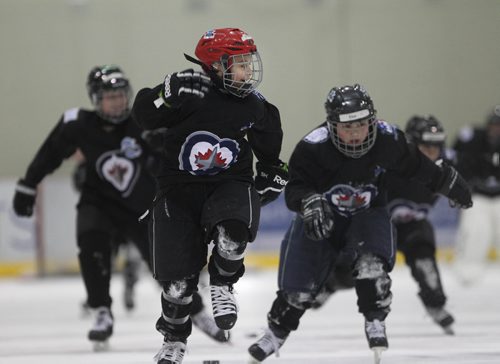 RUTH BONNEVILLE / WINNIPEG FREE 

49.8 TNYF feature.  Grade 4/5 students from Crestview School learn to play hockey on ice with Murray Cobb, Director, Winnipeg Jets Hockey Academy and volunteers at Iceplex Tuesday.  Story on the 12th year, the Winnipeg Jets Hockey Academy's  play-based program that is designed to increase school attendance and high school graduation rates, and instill life skills through the game of hockey. 
 Students name - Marcus. 

See Randy Turner story.
Feb 09/18
