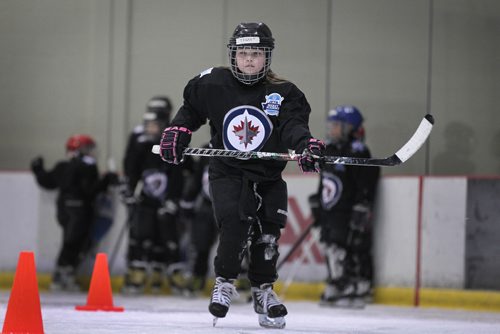 RUTH BONNEVILLE / WINNIPEG FREE 

49.8 TNYF feature.  Grade 4/5 students from Crestview School learn to play hockey on ice with Murray Cobb, Director, Winnipeg Jets Hockey Academy and volunteers at Iceplex Tuesday.  Story on the 12th year, the Winnipeg Jets Hockey Academy's  play-based program that is designed to increase school attendance and high school graduation rates, and instill life skills through the game of hockey. 
Tegan practices on ice.   

See Randy Turner story.
Feb 09/18