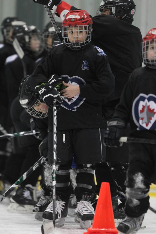 RUTH BONNEVILLE / WINNIPEG FREE 

49.8 TNYF feature.  Grade 4/5 students from Crestview School learn to play hockey on ice with Murray Cobb, Director, Winnipeg Jets Hockey Academy and volunteers at Iceplex Tuesday.  Story on the 12th year, the Winnipeg Jets Hockey Academy's  play-based program that is designed to increase school attendance and high school graduation rates, and instill life skills through the game of hockey. 
 Marcus on ice with classmates.  

See Randy Turner story.
Feb 09/18
