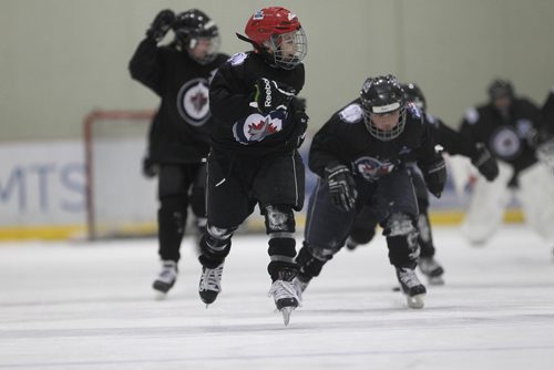 RUTH BONNEVILLE / WINNIPEG FREE 

49.8 TNYF feature.  Grade 4/5 students from Crestview School learn to play hockey on ice with Murray Cobb, Director, Winnipeg Jets Hockey Academy and volunteers at Iceplex Tuesday.  Story on the 12th year, the Winnipeg Jets Hockey Academy's  play-based program that is designed to increase school attendance and high school graduation rates, and instill life skills through the game of hockey. 
Marcus on ice with classmates.  

See Randy Turner story.
Feb 09/18
