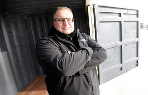 PHIL HOSSACK / Winnipeg Free Press - Mike Millard, a former meth addict now anti drug advocate poses inside a shipping container like the ones he's working to turn into affordable housing built by recovering addicts..... -  February 10, 2018