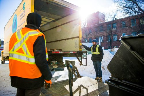 MIKAELA MACKENZIE / WINNIPEG FREE PRESS
Greg Teillet (right) and Ben Scrivens load up a truck at the Mother Earth Recycling centre in Winnipeg, Manitoba on Monday, Feb. 12, 2018. The centre recycles things like electronics and mattresses, but also offers jobs and training to low income people to help get them on their feet.
180212 - Monday, February 12, 2018.