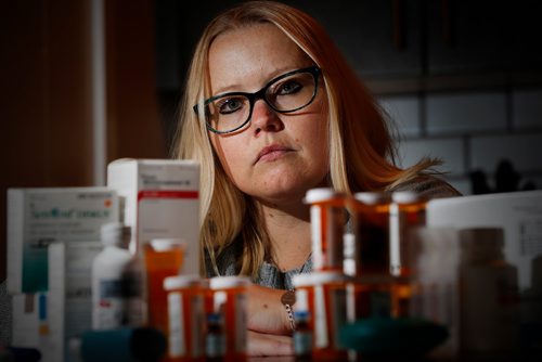 JOHN WOODS / WINNIPEG FREE PRESS
Tara-Lynn Reeves, who has cystic fibrosis, is photographed in her home with all of the medication she takes on a daily basis Monday, February 12, 2018. The province has quietly implemented a change that will see people on the 'special drugs program' switched over to Pharmacare, resulting in them now having to pay more for their life saving meds. Reeves is one of the people affected by, and very concerned with, the change.