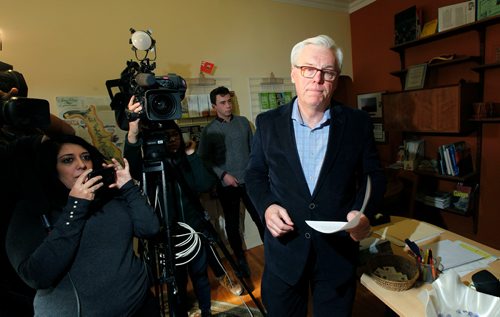PHIL HOSSACK / Winnipeg Free Press - Former NDP Premier Greg Selinger makes his way past media arriving at a press conference called at his consituency office Tuesday morning. See Nick Martin Story.-  February 13, 2018