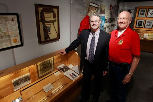 BORIS MINKEVICH / WINNIPEG FREE PRESS
From left, John Burchill and Jack Templeman pose for a photo in the Police Museum next to the Manitoba Provincial Police are. They are writing a book about the MB Provincial Police, which existed from 1870 to 1934. BILL REDEKOP STORY Feb. 13, 2018