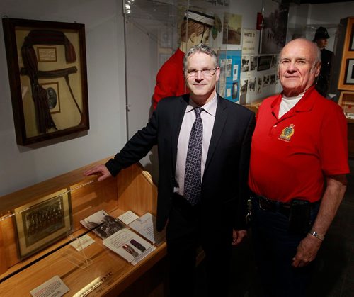 BORIS MINKEVICH / WINNIPEG FREE PRESS
From left, John Burchill and Jack Templeman pose for a photo in the Police Museum next to the Manitoba Provincial Police are. They are writing a book about the MB Provincial Police, which existed from 1870 to 1934. BILL REDEKOP STORY Feb. 13, 2018