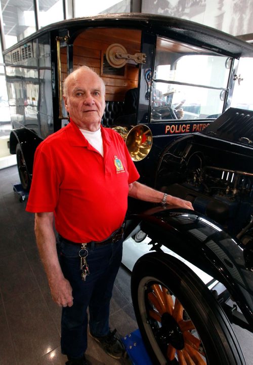 BORIS MINKEVICH / WINNIPEG FREE PRESS
The Winnipeg Police Museum at the new Police Headquarters. Jack Templeman poses for a photo in the museum with the 1925 REO Speedwagon police patrol. BILL REDEKOP STORY Feb. 13, 2018