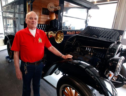 BORIS MINKEVICH / WINNIPEG FREE PRESS
The Winnipeg Police Museum at the new Police Headquarters. Jack Templeman poses for a photo in the museum with the 1925 REO Speedwagon police patrol. BILL REDEKOP STORY Feb. 13, 2018