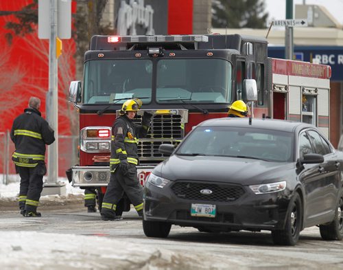 PHIL HOSSACK / WINNIPEG FREE PRESS - Police and FIrefighters prepare to clear the scene at Bank/Varennes ave and St Annes Rd Tuesday afternoon after the death you a young boy. See story. February 13, 2018