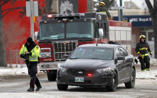 PHIL HOSSACK / WINNIPEG FREE PRESS - Police and FIrefighters prepare to clear the scene at Bank/Varennes ave and St Annes Rd Tuesday afternoon after the death you a young boy. See story. February 13, 2018