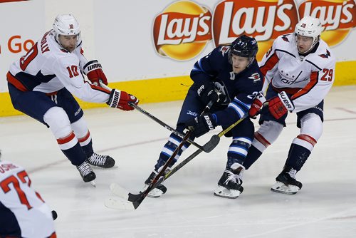 JOHN WOODS / WINNIPEG FREE PRESS
Winnipeg Jets' Nikolaj Ehlers (27) makes the pass with pressure from Washington Capitals' Brett Connolly (10) and Christian Djoos (29) during first period NHL action in Winnipeg on Tuesday, February 13, 2018.