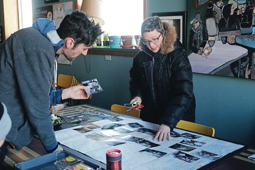 Canstar Community News Feb. 7, 2018 - Local artist Leigh-Anne Kehler arranges photographs on top of a Winnipeg map. (LIGIA BRAIDOTTI/CANSTAR/TIMES)