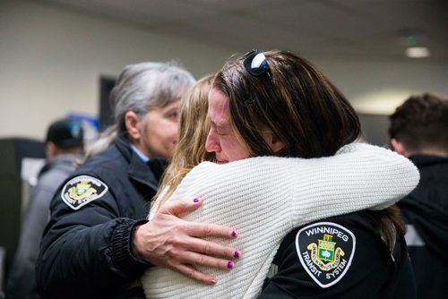 MIKAELA MACKENZIE / WINNIPEG FREE PRESS
Crystal Hanley (right) hugs Penny Teron at a memorial for Irvine Jubal Fraser, an operator killed one year ago, held by the he Amalgamated Transit Union in Winnipeg, Manitoba on Wednesday, Feb. 14, 2018. 
180214 - Wednesday, February 14, 2018.