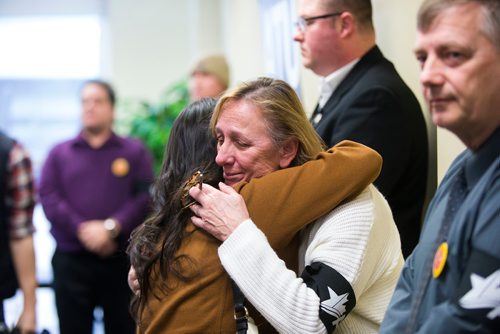 MIKAELA MACKENZIE / WINNIPEG FREE PRESS
City councillor Devi Sharma (left) hugs Penny Teron at a memorial for Irvine Jubal Fraser, an operator killed one year ago, held by the he Amalgamated Transit Union in Winnipeg, Manitoba on Wednesday, Feb. 14, 2018. 
180214 - Wednesday, February 14, 2018.